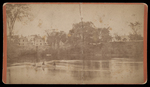 [Untitled photograph of river scene and two men on canoe] by Unknown