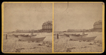 [Building in the background and boats docked on sand in Old Orchard, Me.] by C.G. Gooding