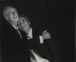 Two older gentlemen embracing and smiling by Tom Antonik