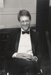 Smiling man in tuxedo by Tom Antonik
